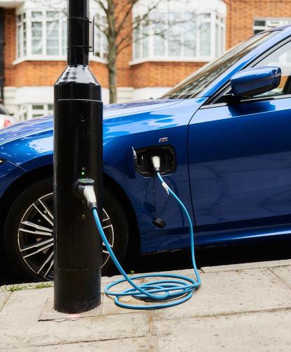 Ubitricity lamp post charger with a blue EV plugged in