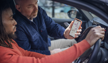 Zapmap appp on phone screen - route planning inside EV